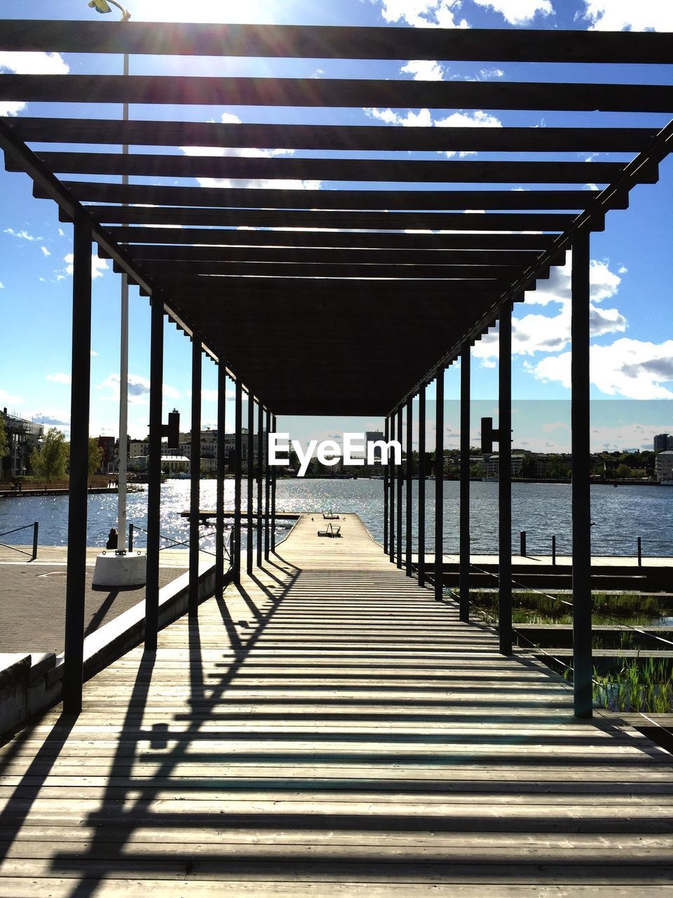 Pier leading towards lake