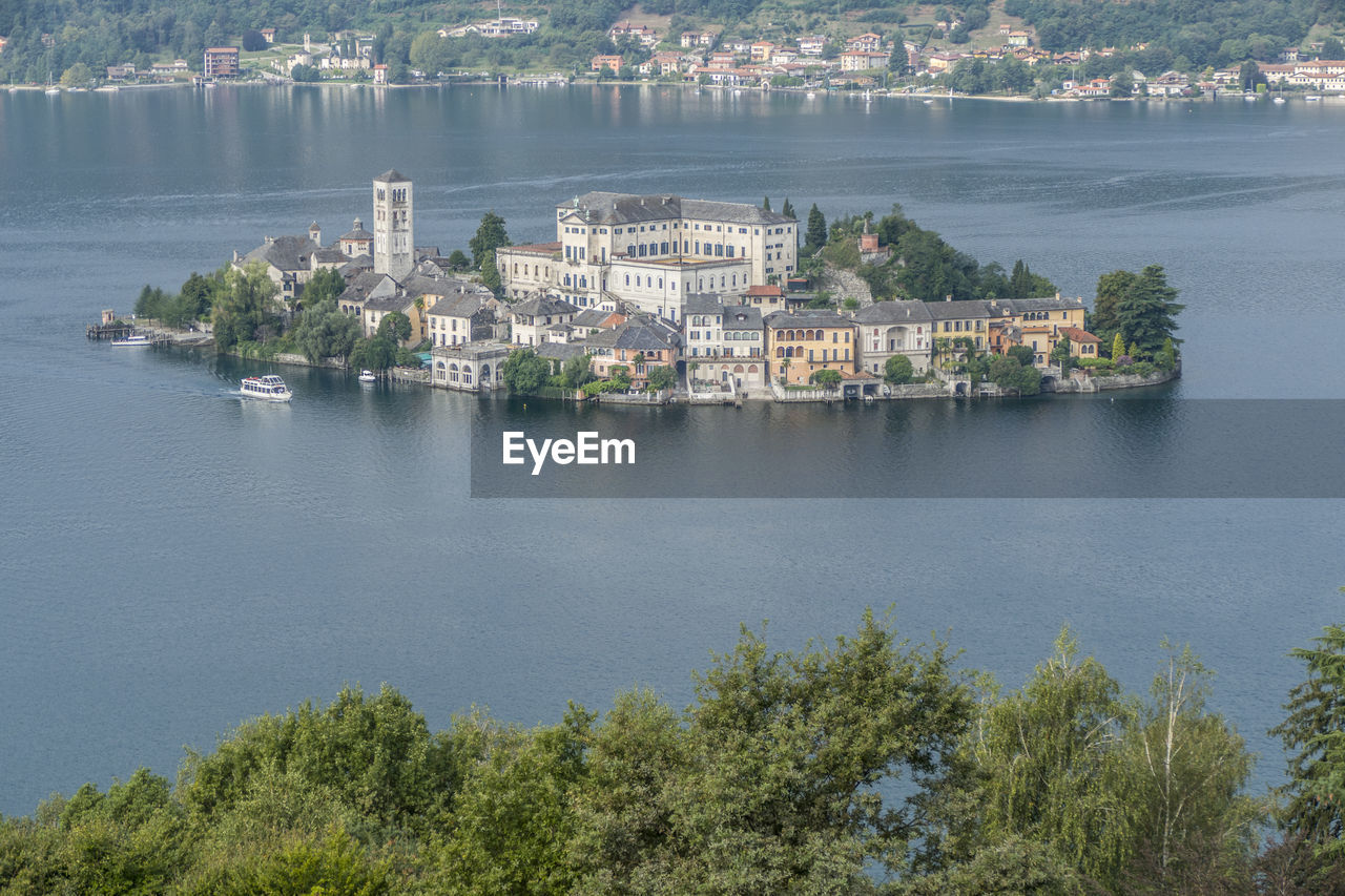 High angle view of buildings by sea