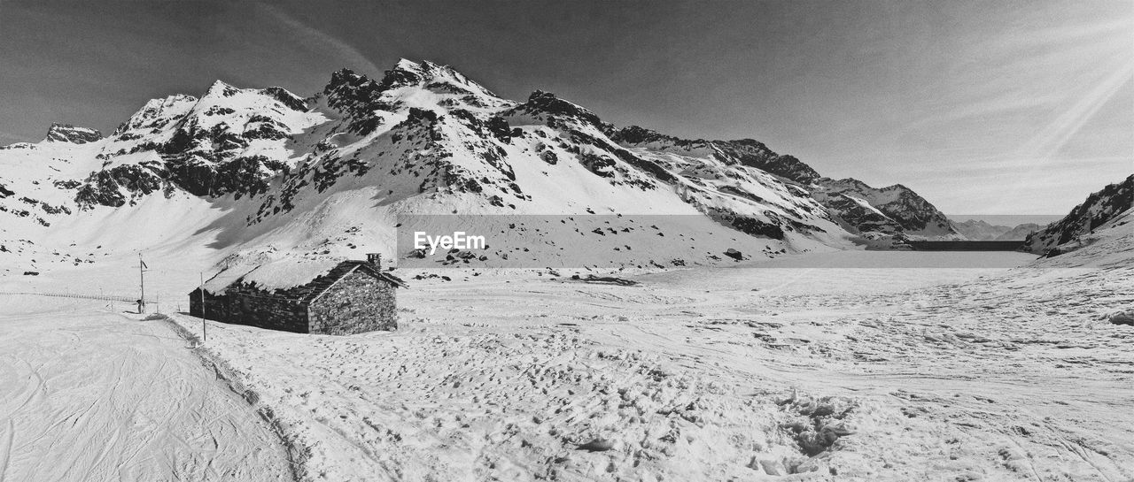 Scenic view of snow covered mountain against sky