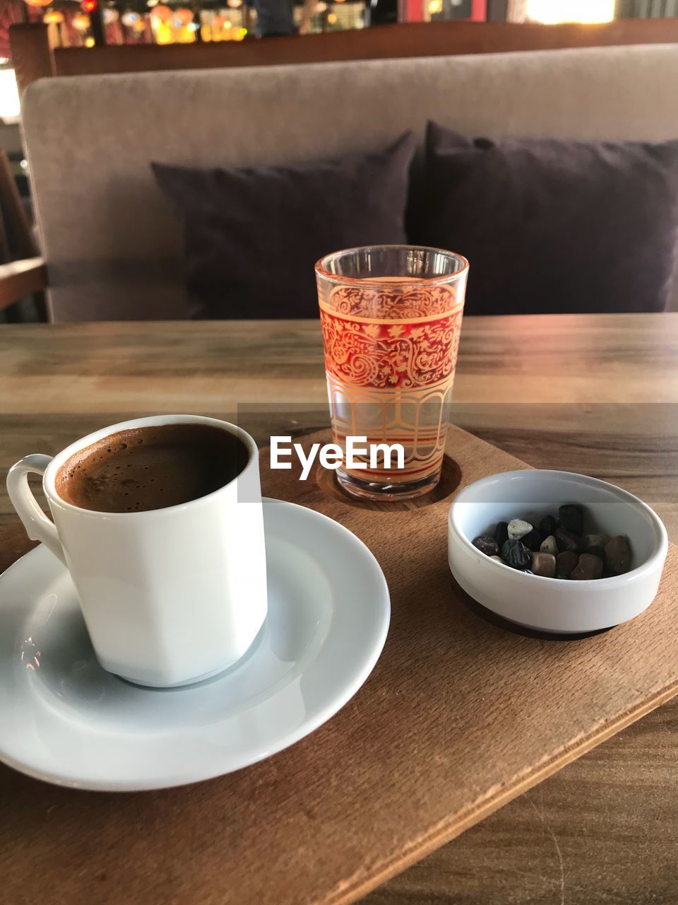 COFFEE CUP WITH TEA ON TABLE