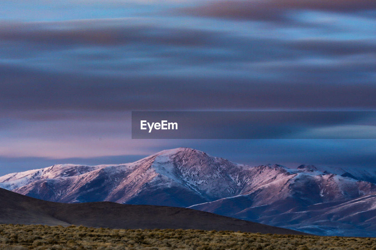 Scenic view of snowcapped mountains against sky