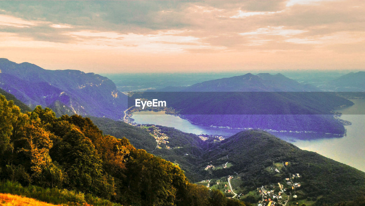 SCENIC VIEW OF MOUNTAIN RANGE AGAINST SKY DURING SUNSET