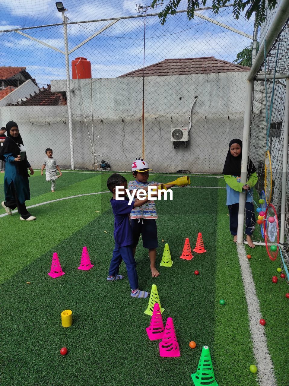 multi colored, high angle view, plant, day, nature, sports, green, playground, outdoors, screenshot, hanging, art, decoration, leisure activity, group of people, celebration, directly above