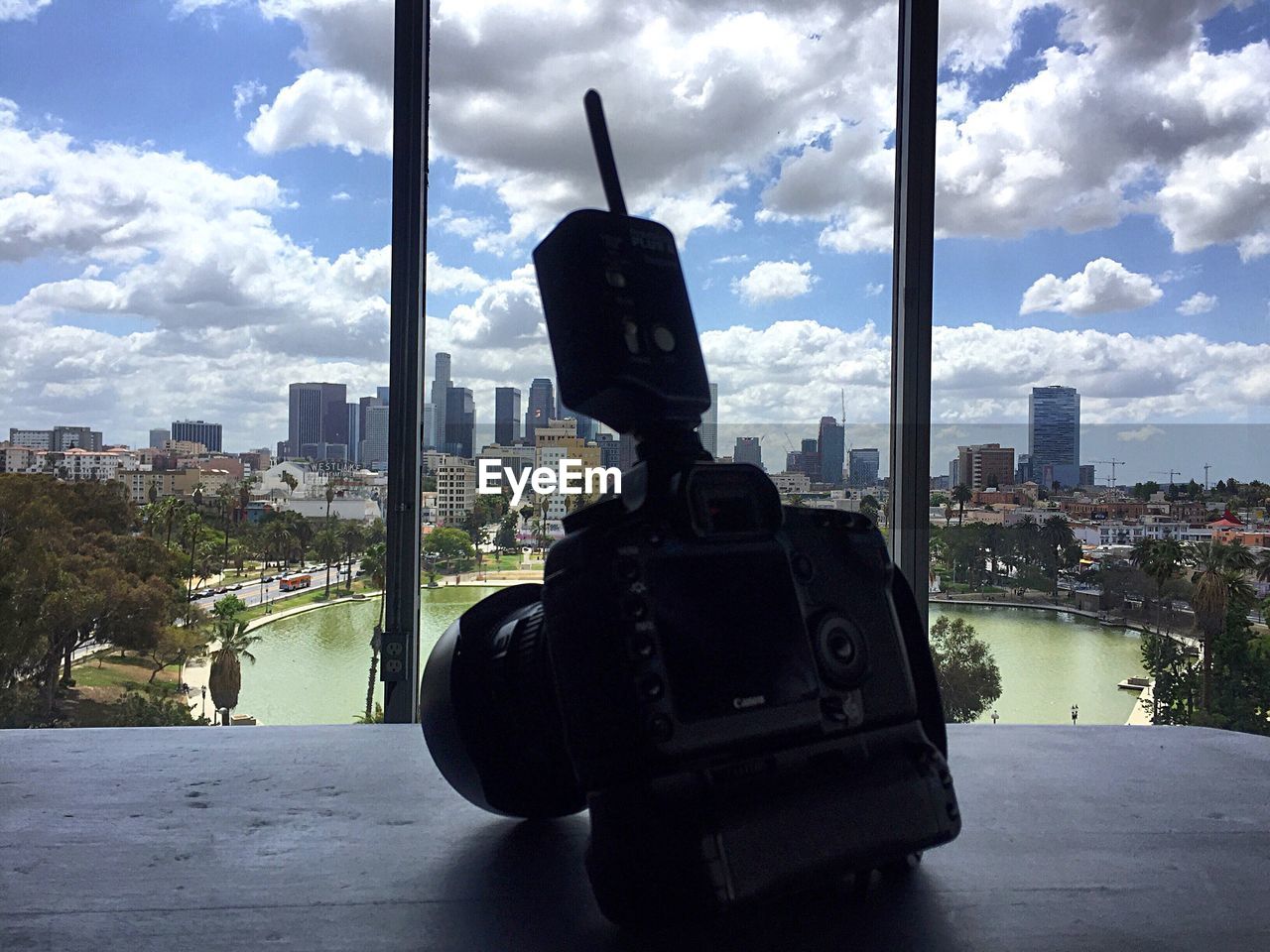 VIEW OF CITYSCAPE AGAINST CLOUDY SKY