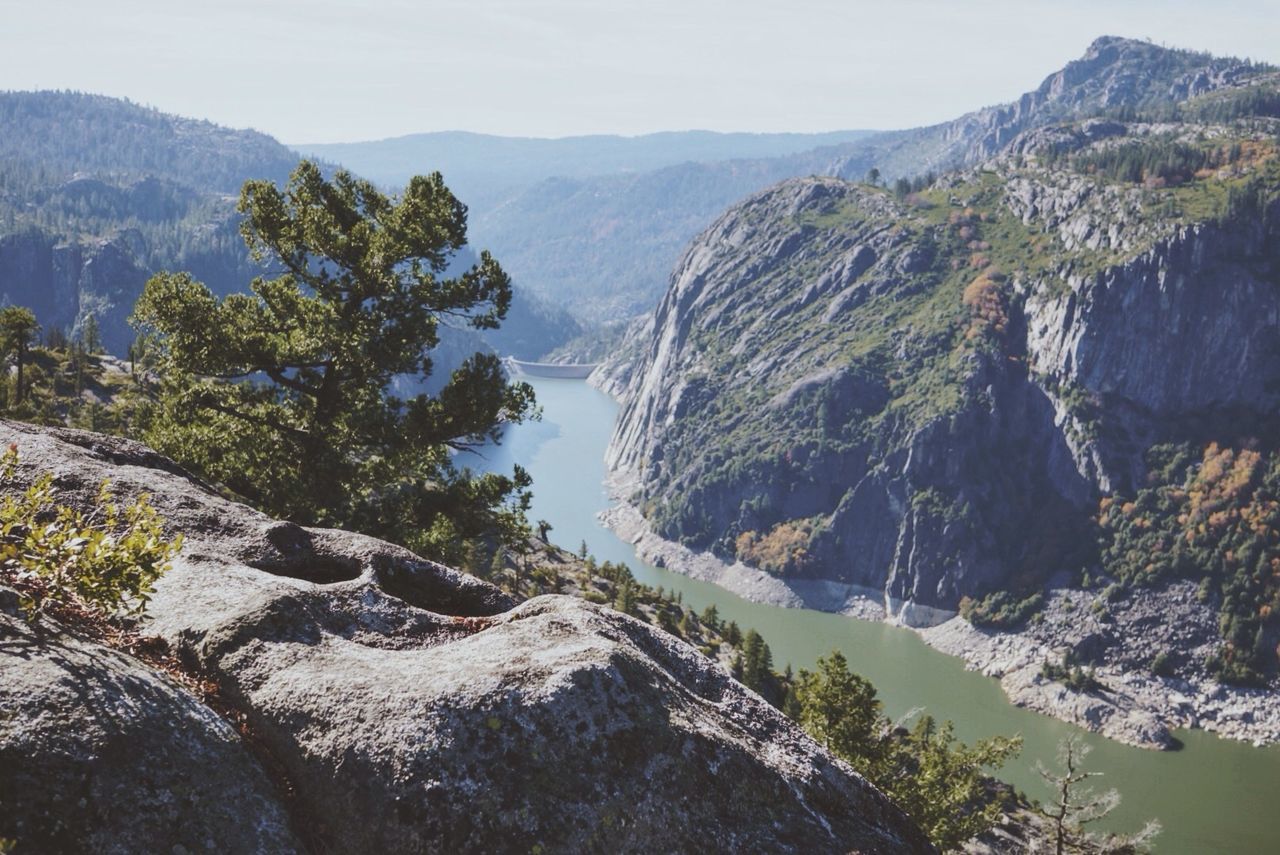 High angle view of river amidst mountains