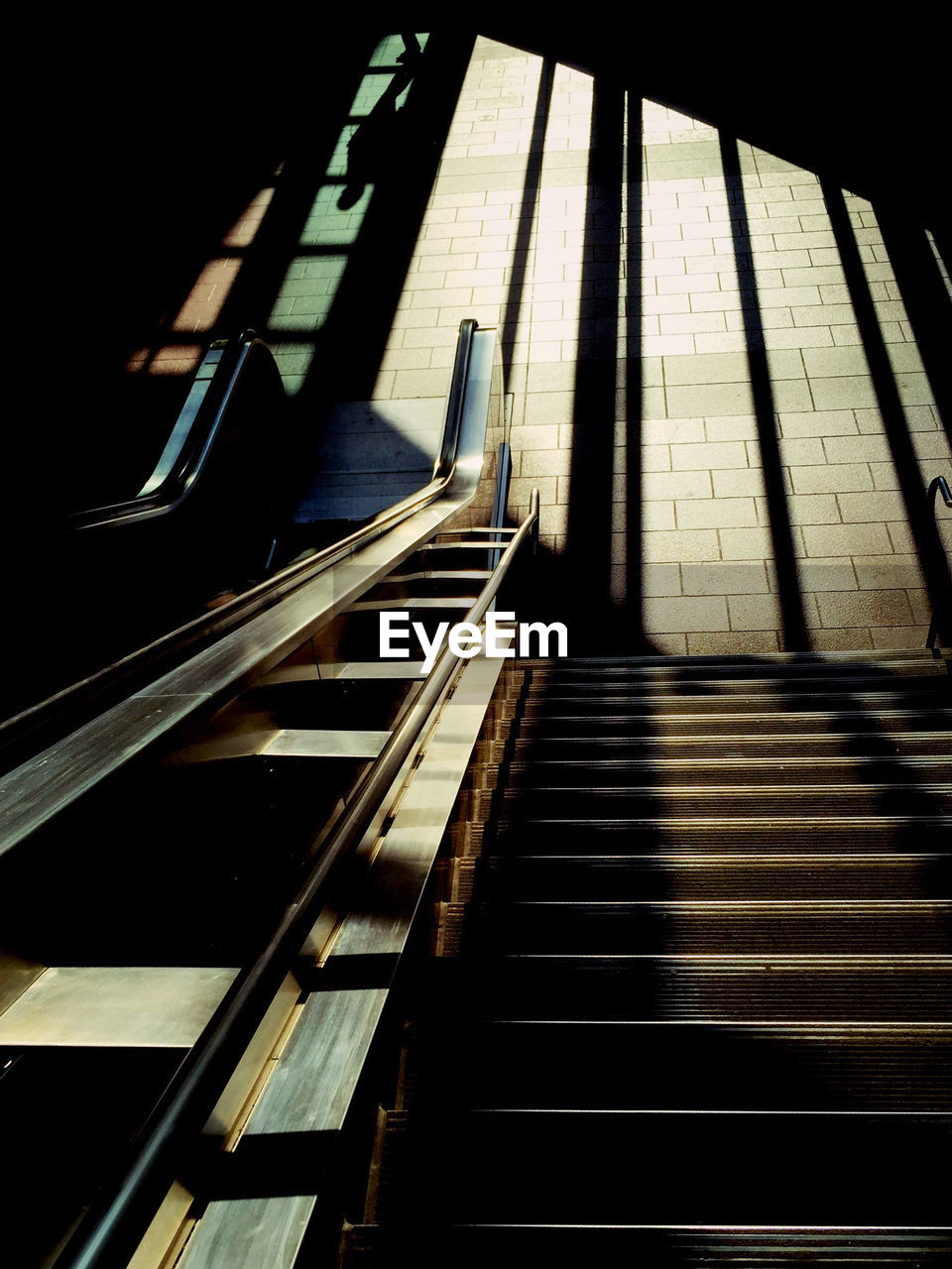 High angle view of staircase and escalator in building
