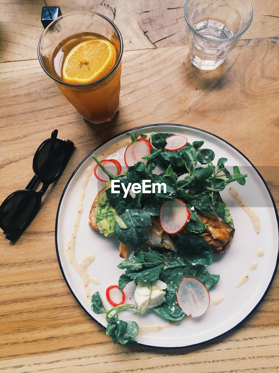 High angle view of  avocado and mackerel bruschetta breakfast served on table