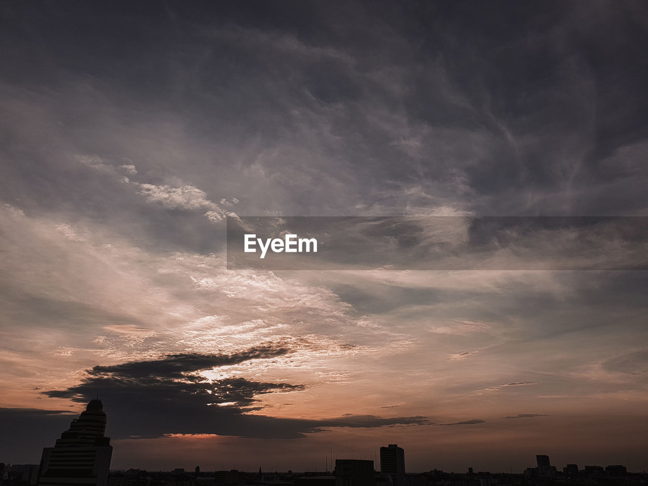  view of buildings against cloudy sky