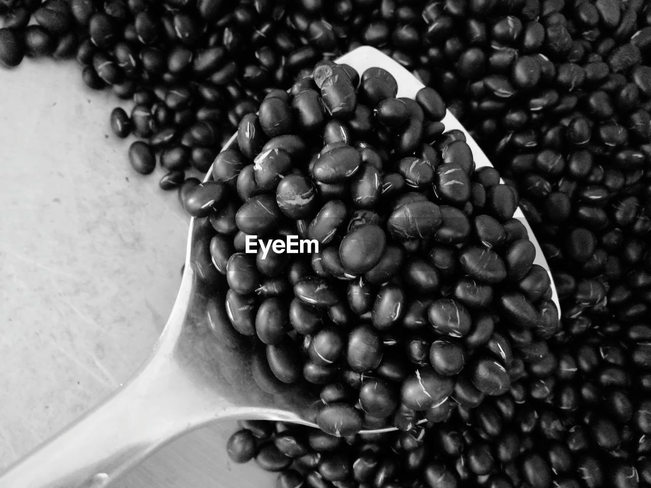 CLOSE-UP OF COFFEE BEANS ON FLOOR