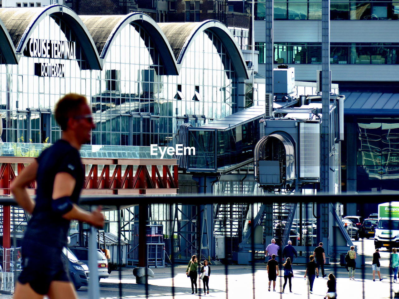 GROUP OF PEOPLE WALKING IN CITY