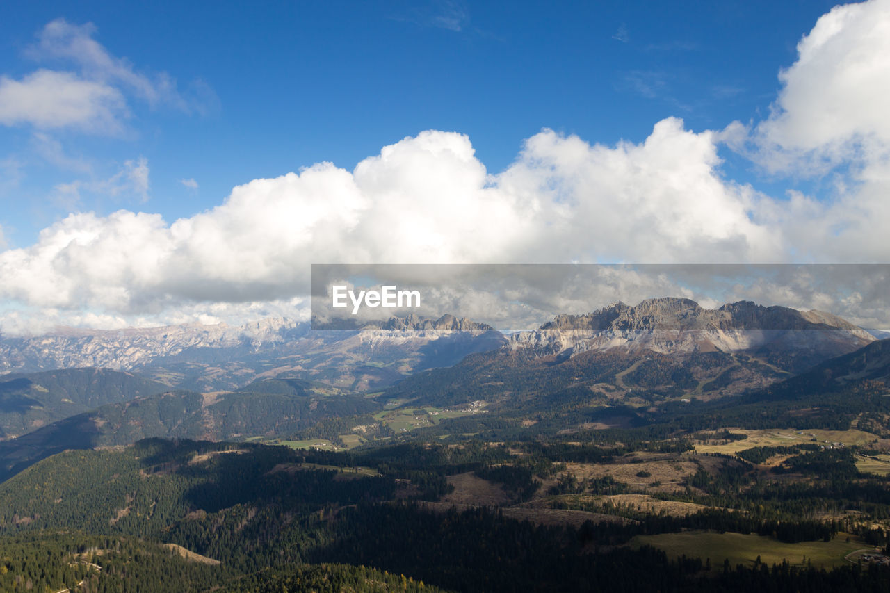 environment, mountain, sky, cloud, landscape, scenics - nature, nature, beauty in nature, mountain range, land, travel, travel destinations, tree, forest, blue, no people, tourism, outdoors, tranquility, plant, pinaceae, snow, plateau, winter, mountain peak, pine tree, tranquil scene, cold temperature, social issues, valley, trip, coniferous tree, vacation, cloudscape, day, non-urban scene, holiday, wilderness, idyllic, ridge, pine woodland, summer, high up, sunlight, fog, snowcapped mountain, rural scene