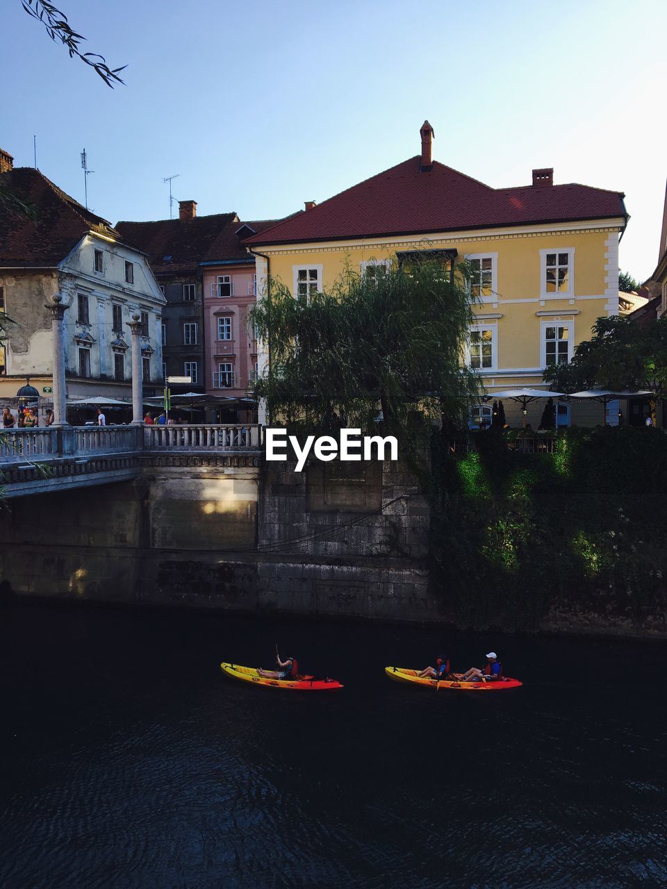 VIEW OF CANAL BY BUILDINGS IN CITY