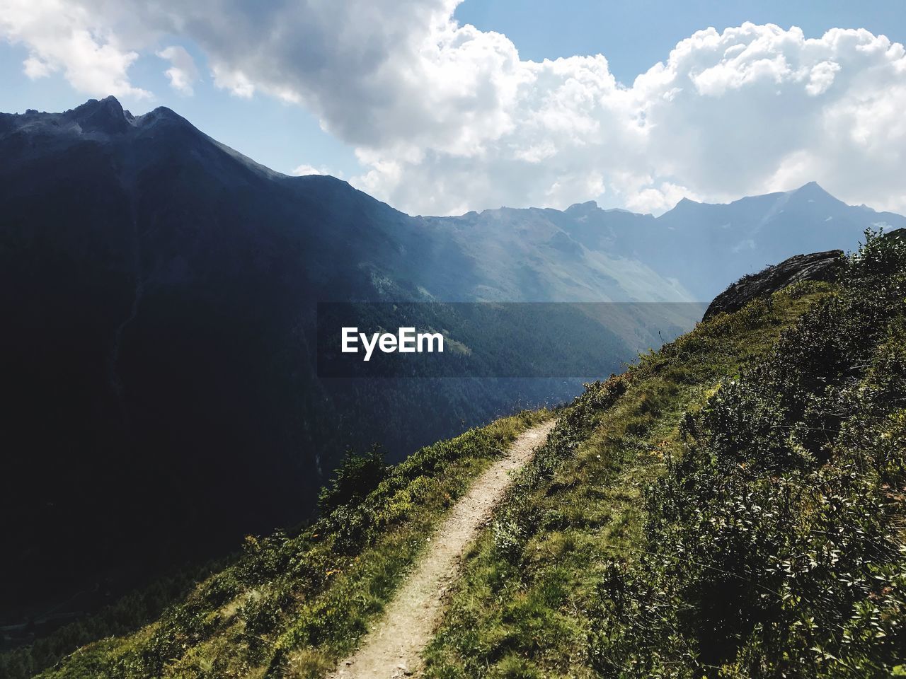 PANORAMIC SHOT OF MOUNTAIN RANGE AGAINST SKY