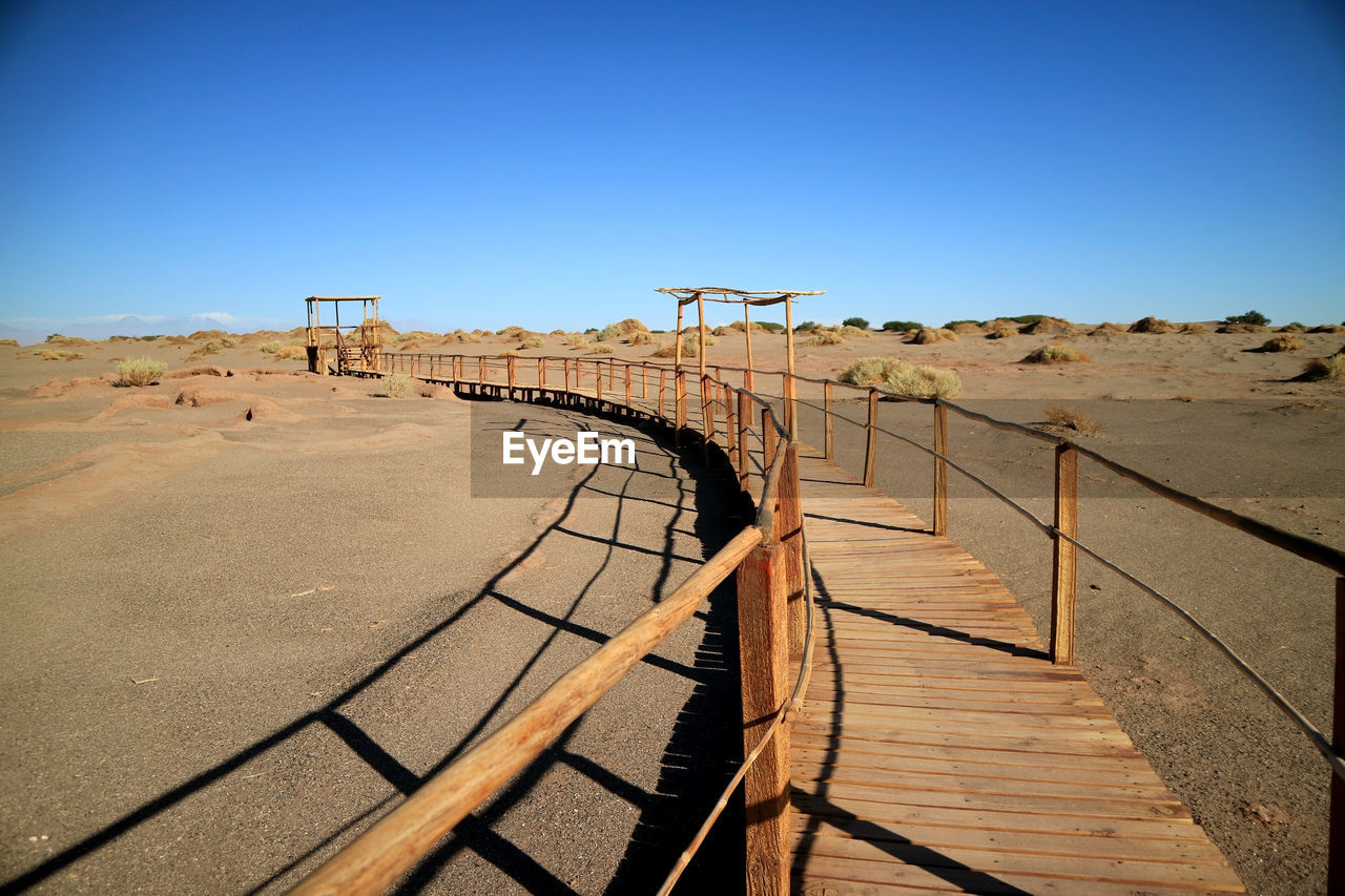 Wooden walkway in the archaeological site of tulor, atacama desert , northern chile