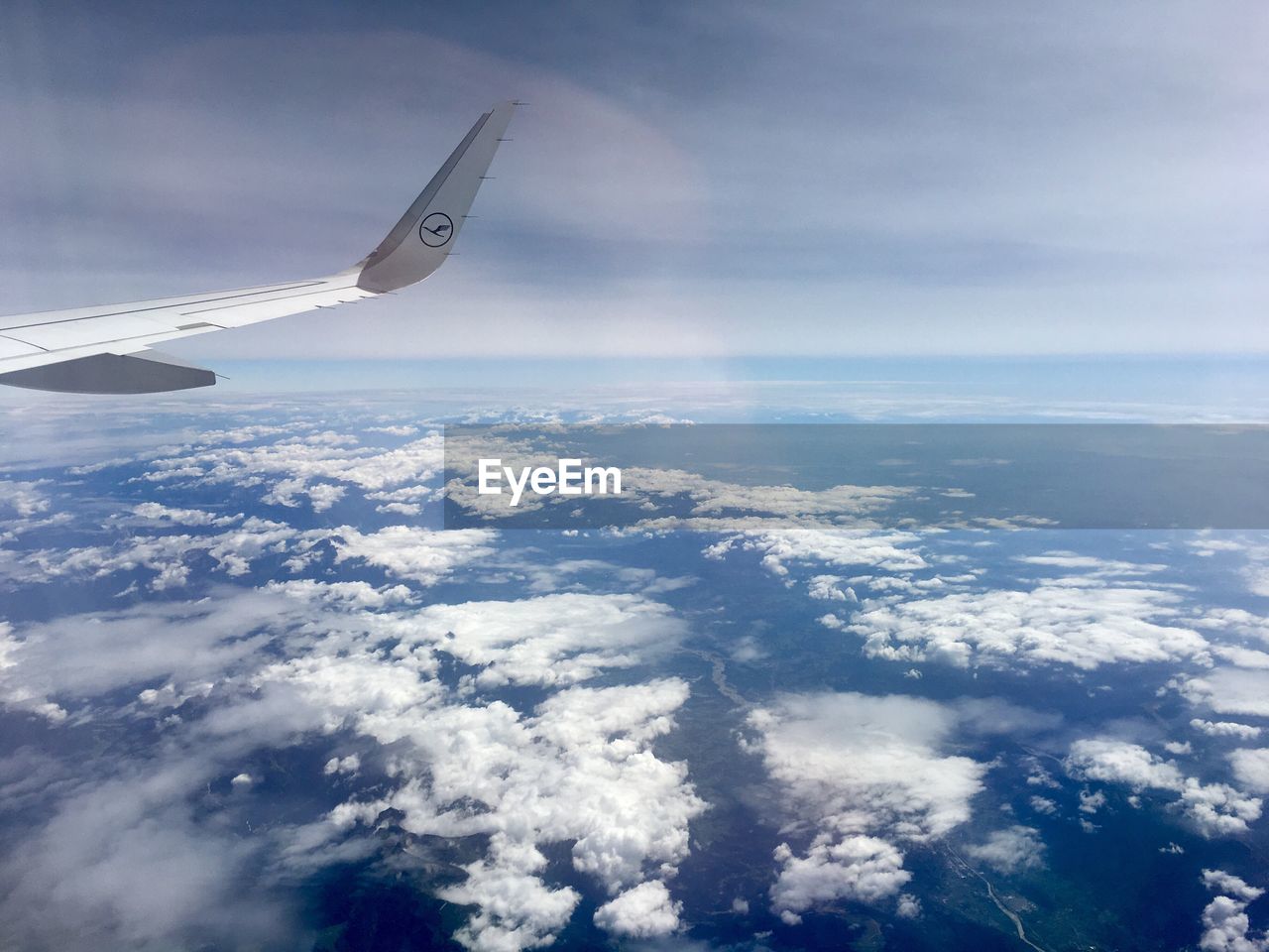 AERIAL VIEW OF AIRCRAFT WING OVER SEA