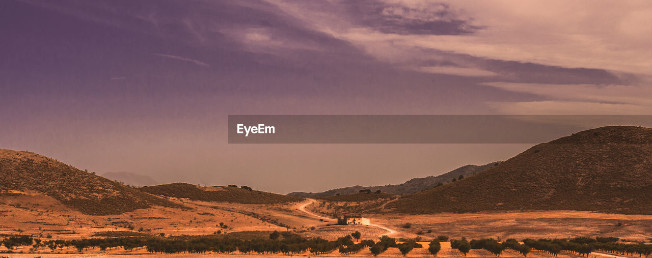 SCENIC VIEW OF LANDSCAPE AGAINST SKY DURING SUNSET