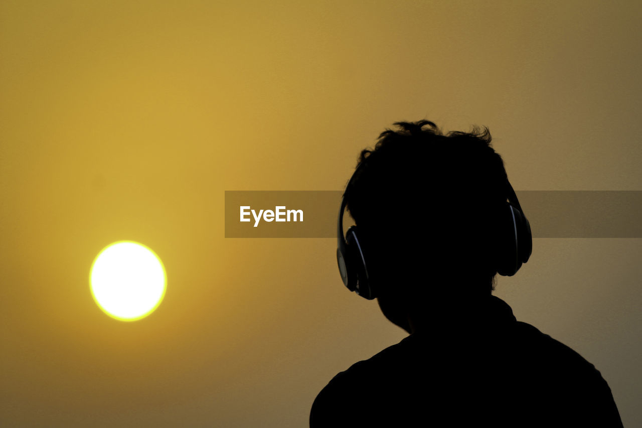 PORTRAIT OF SILHOUETTE MAN STANDING AGAINST ORANGE SKY