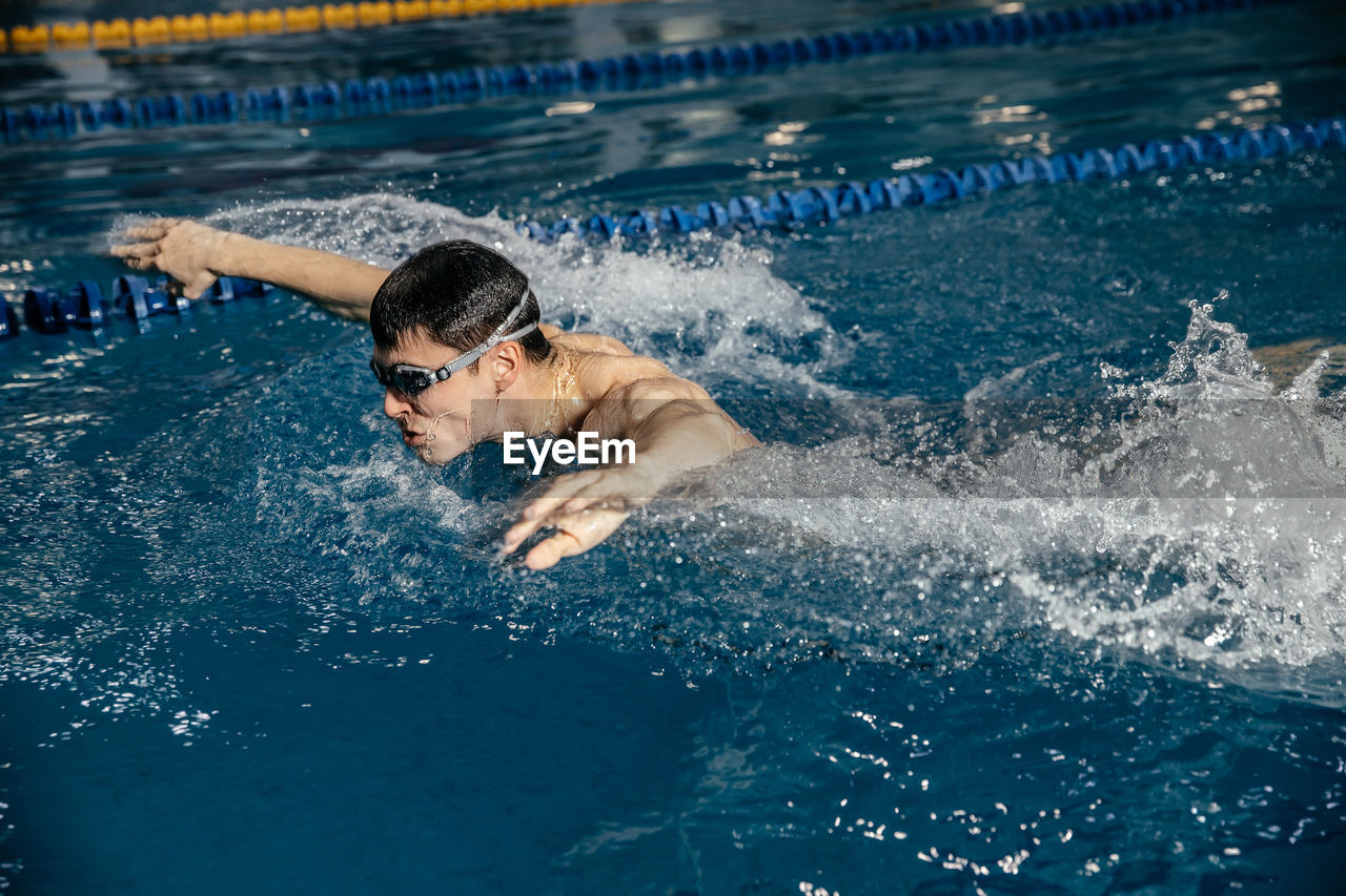 High angle view of man swimming in pool