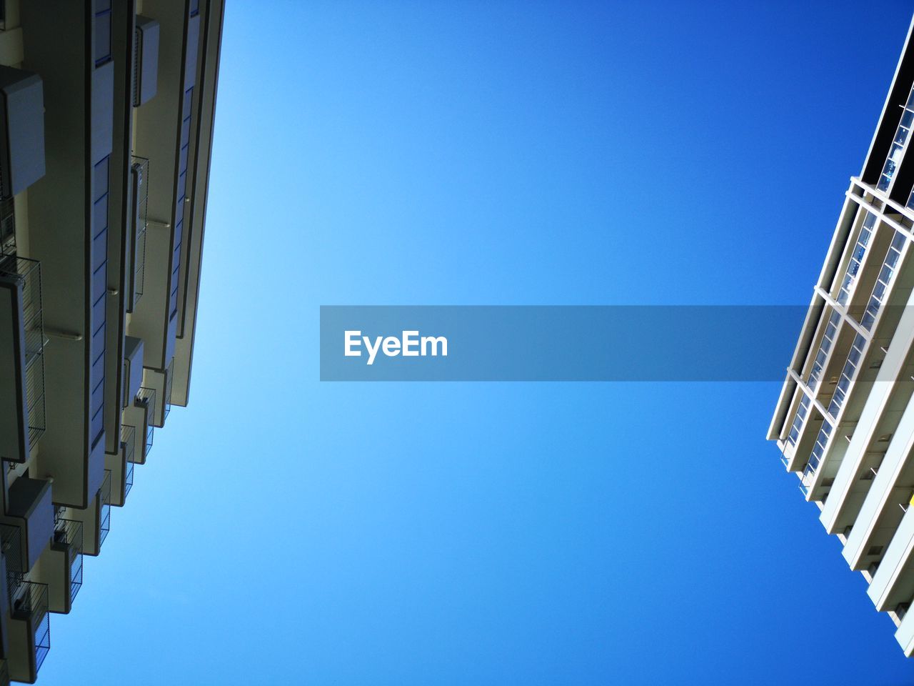 LOW ANGLE VIEW OF BUILDINGS AGAINST CLEAR SKY