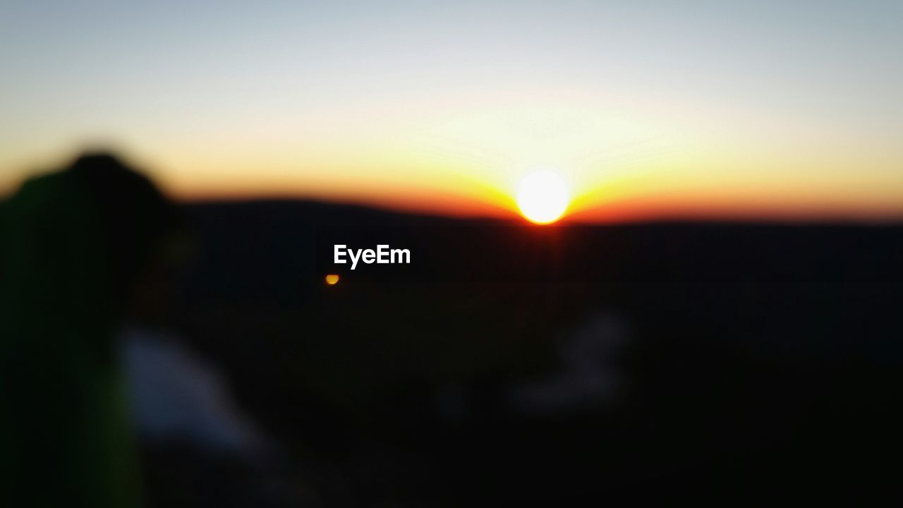 SILHOUETTE OF TREES AT SUNSET