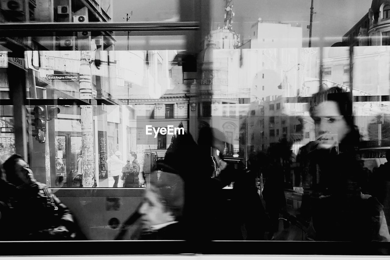 People in bus seen through windows