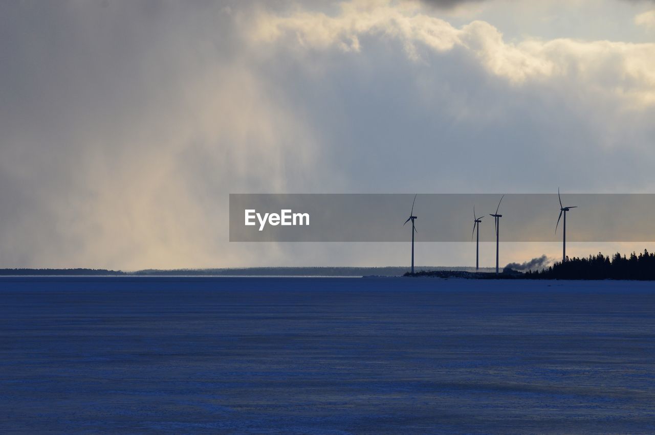 Scenic view of sea against sky during winter