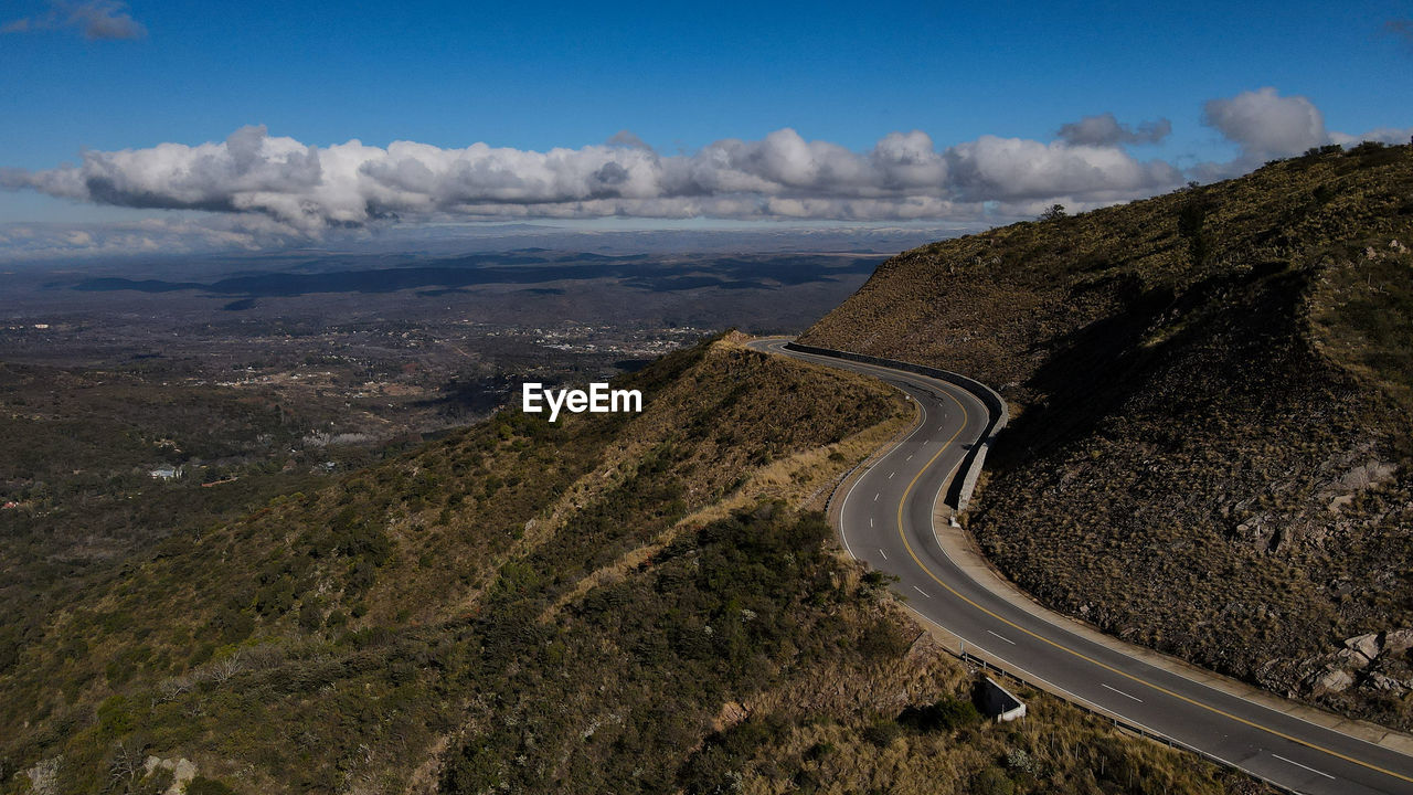 Aerial view of road by land against sky