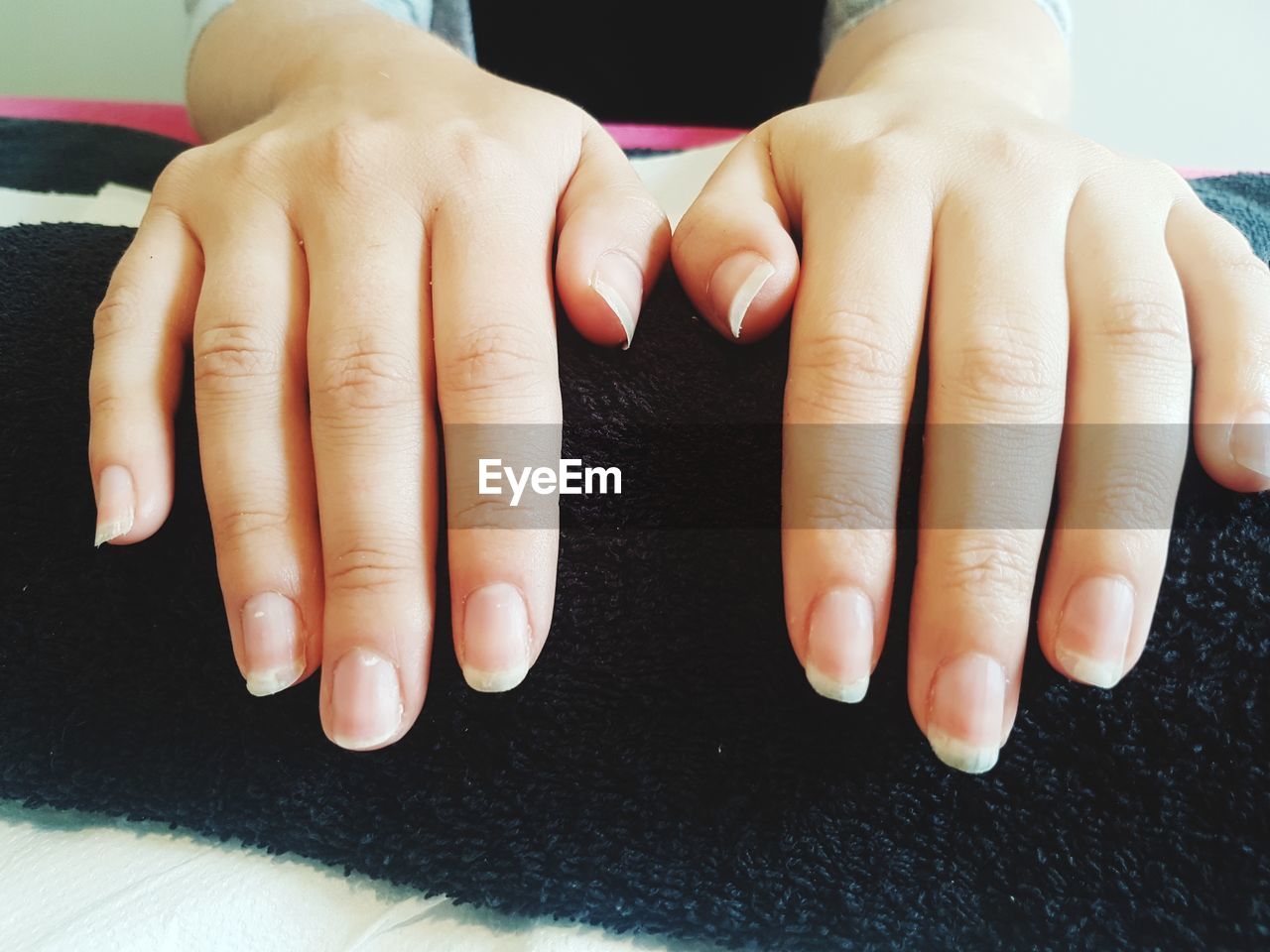 CLOSE-UP OF WOMAN HANDS WITH BABY