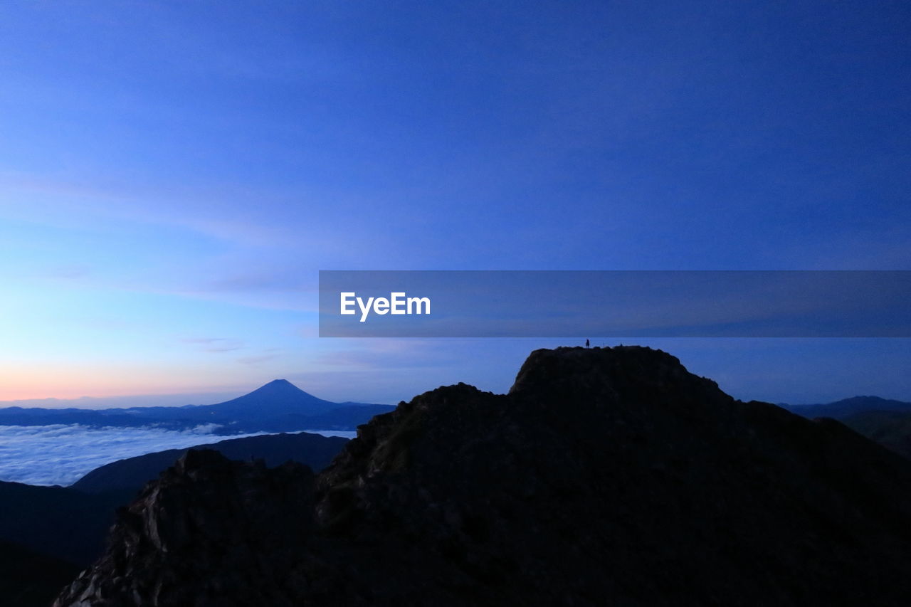 Scenic view of mountain summit against sky