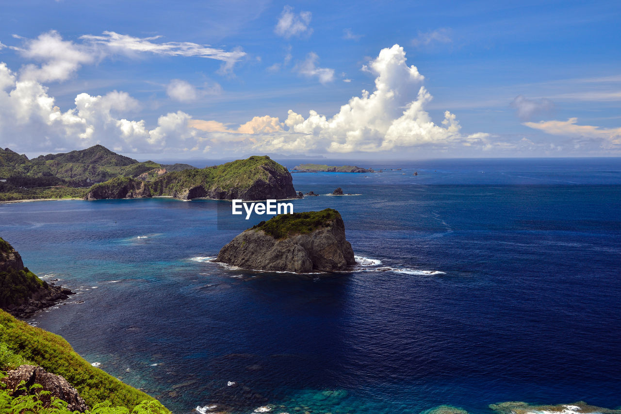 Scenic view of sea against cloudy sky