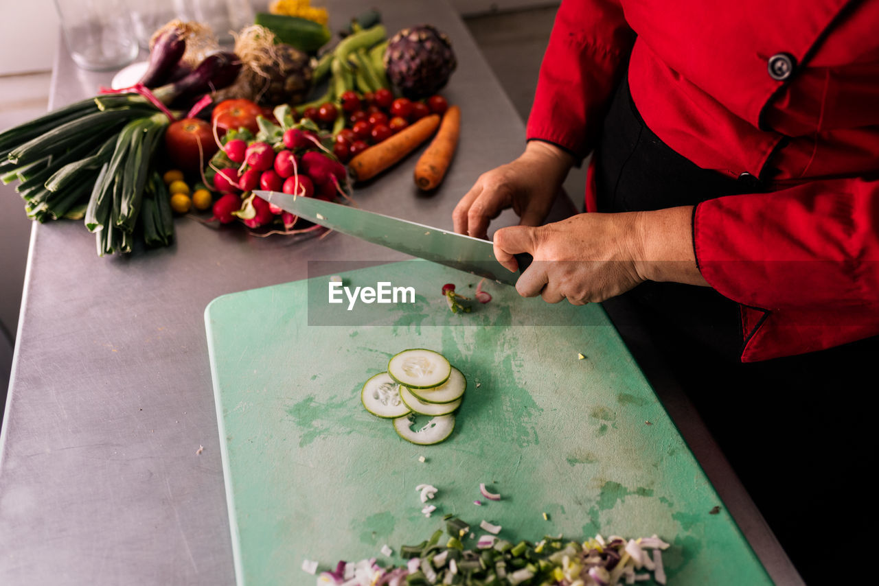 Stock photo of unrecognized chef working in the kitchen.