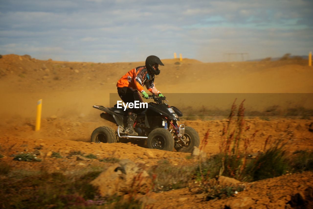 Man quadbiking on sand at reykjanes