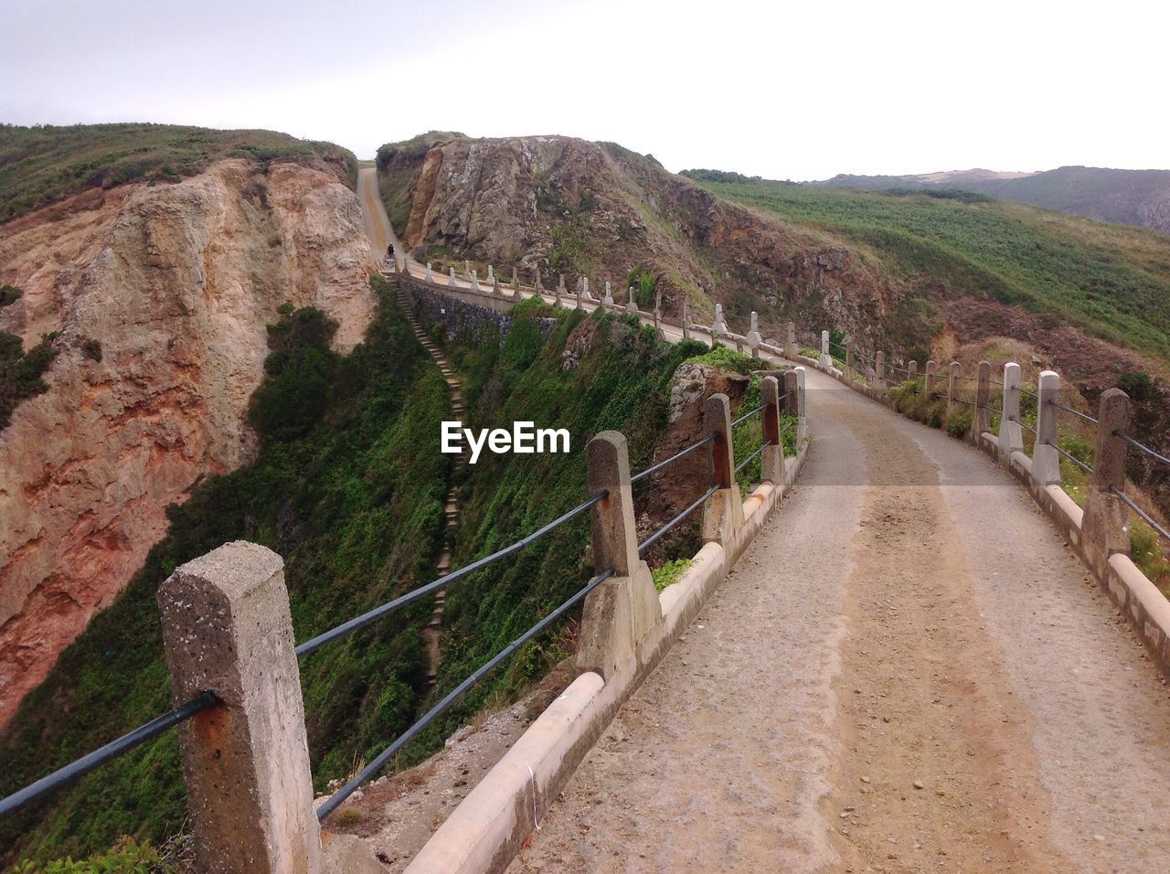 ROAD LEADING TOWARDS MOUNTAINS