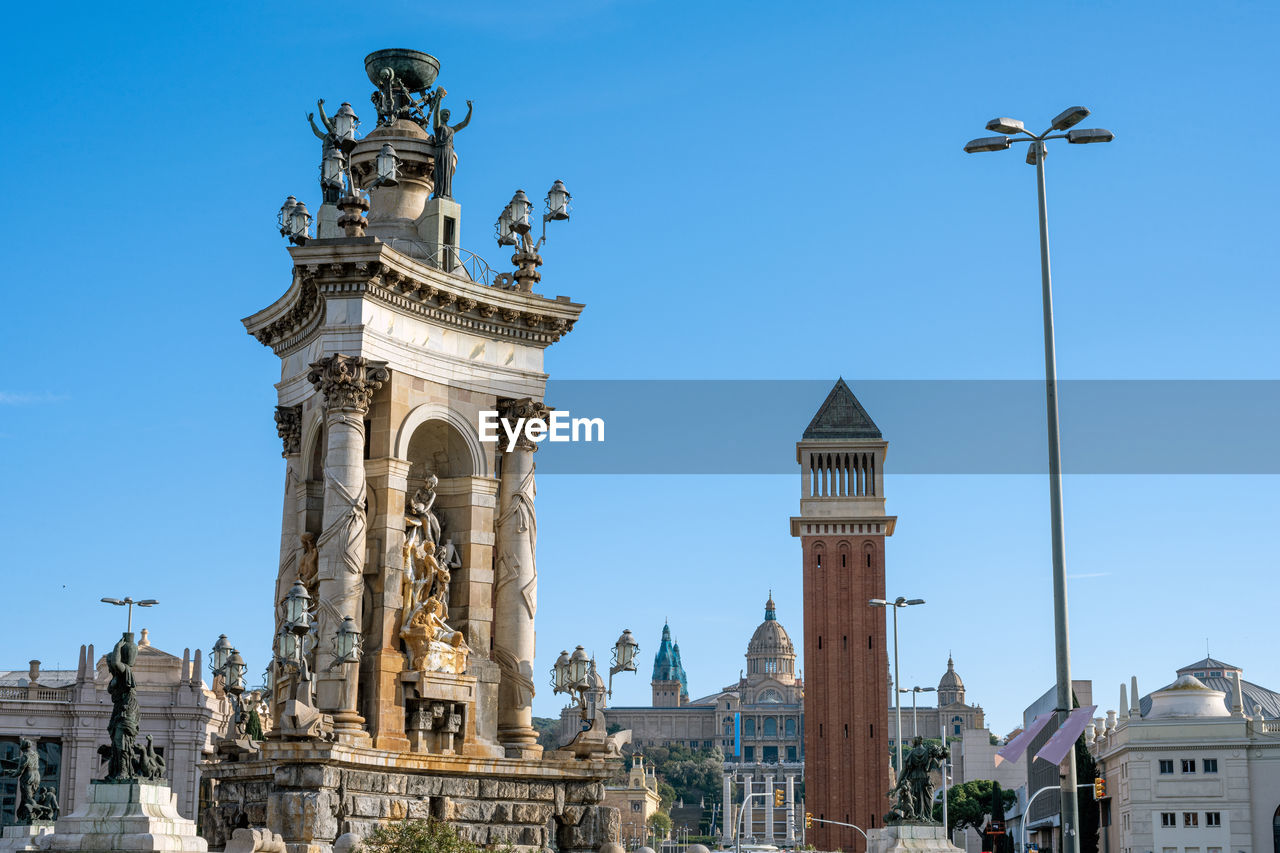 Plaza de espana in barcelona with the palace of montjuic in the back