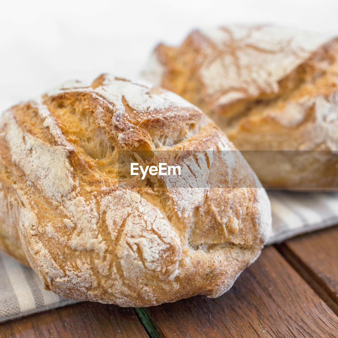 food and drink, food, bread, baked, loaf of bread, freshness, wood, no people, healthy eating, rye bread, indoors, wellbeing, fast food, close-up, whole grain, table, ciabatta, studio shot, sourdough, store, rustic, still life, breakfast, dessert, bakery, french food, brown bread, produce