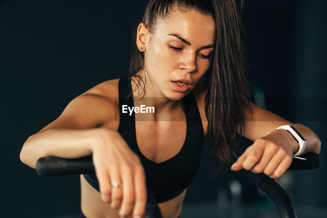 Young woman exercising at gym