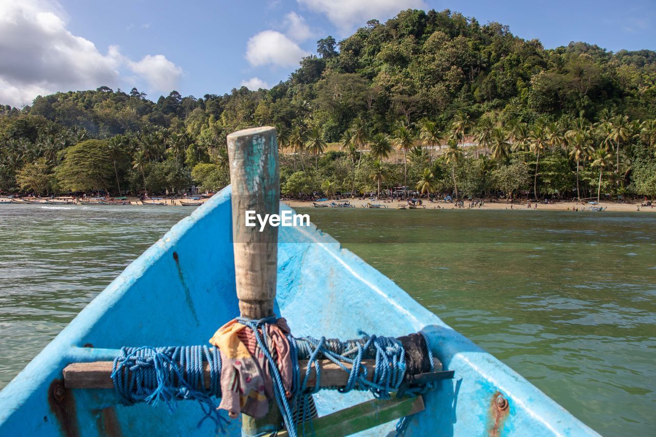 low section of man sitting on boat