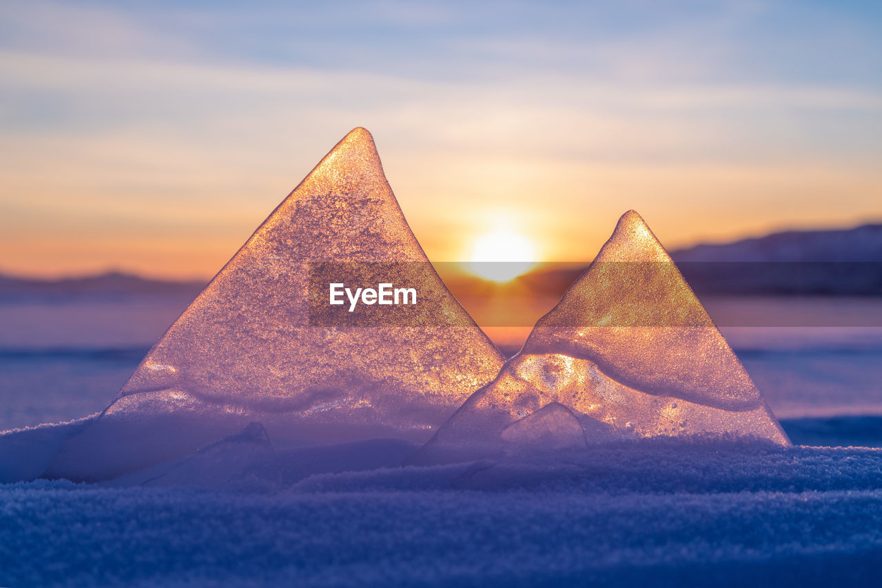 scenic view of sea against clear sky during sunset