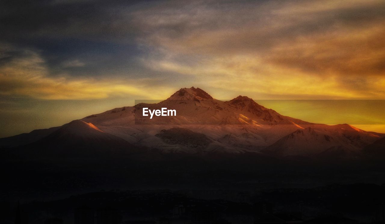 Scenic view of mountains against sky during sunset