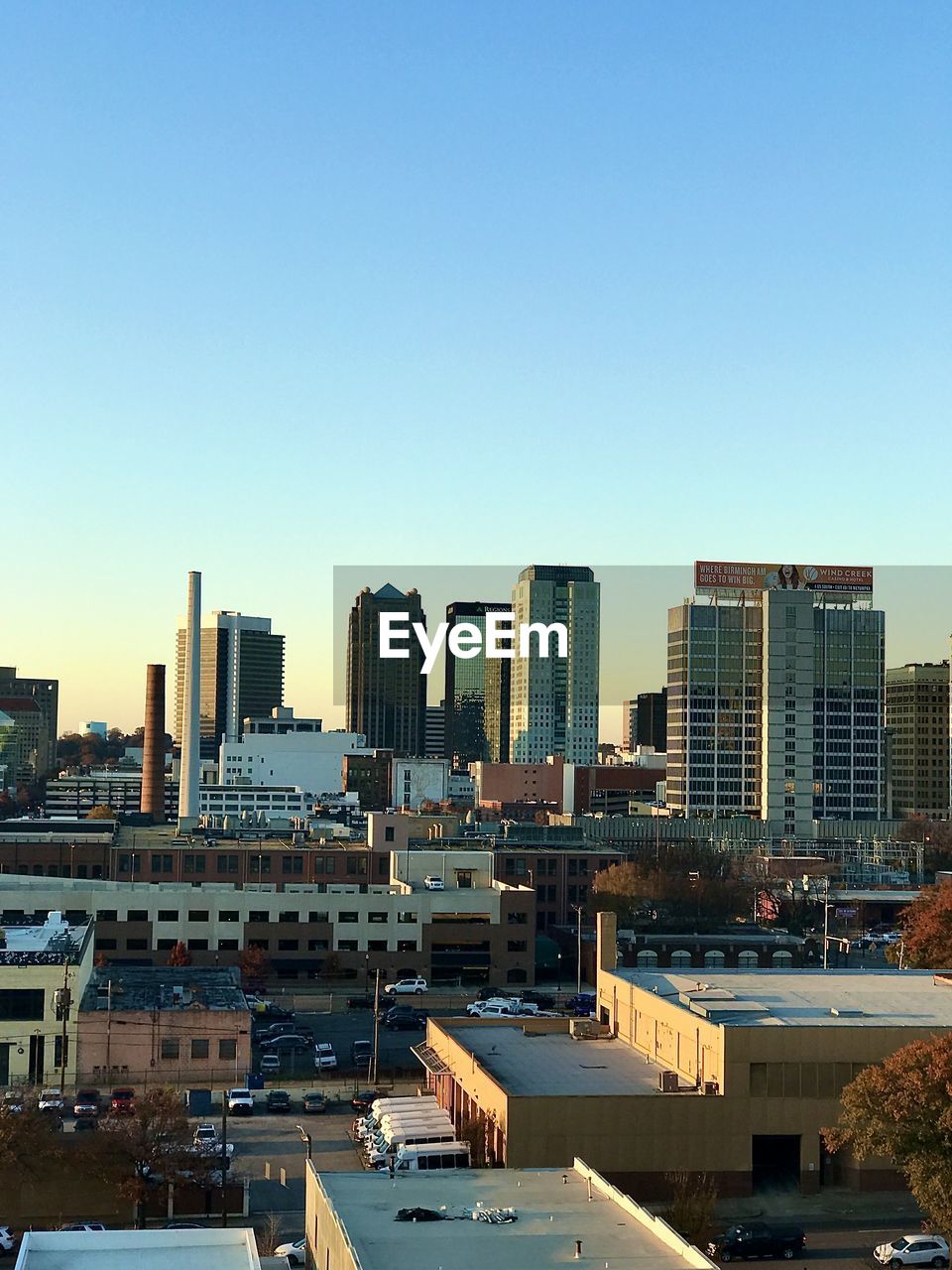 Modern buildings in city against clear sky