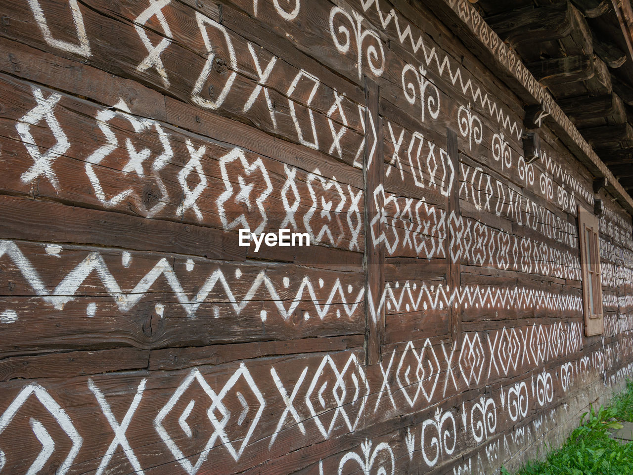 LOW ANGLE VIEW OF TEXT WRITTEN ON WOOD