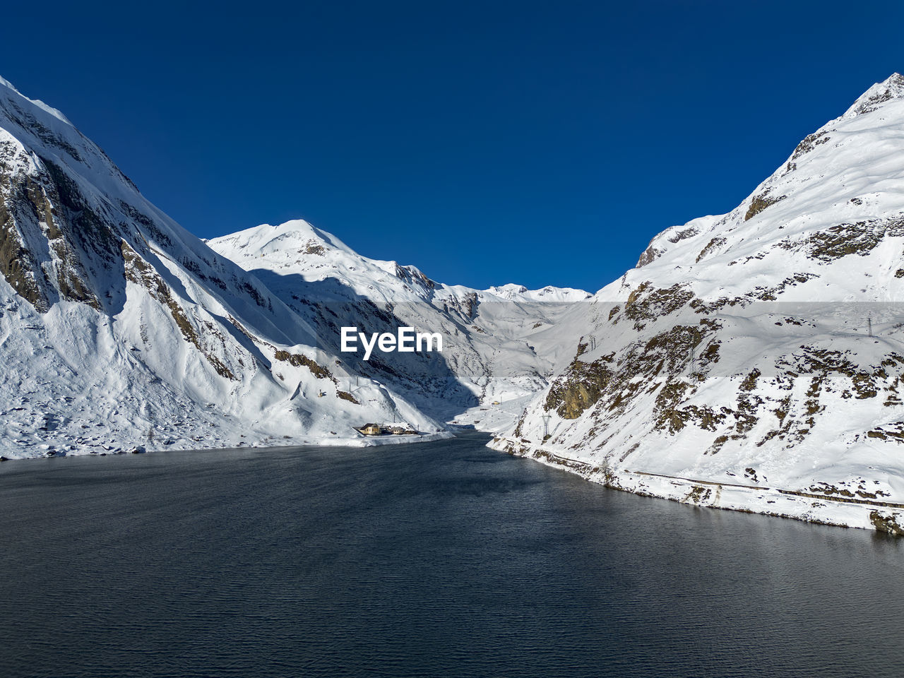 scenic view of snowcapped mountains against clear blue sky