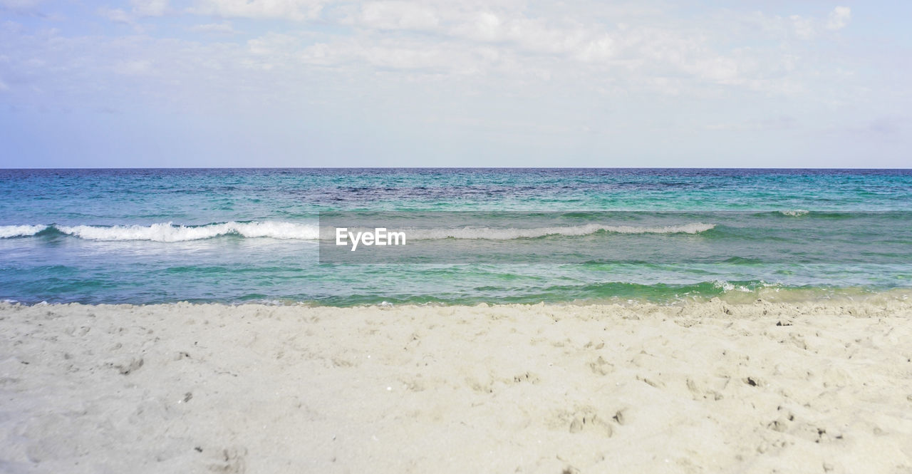 Scenic view of beach against sky