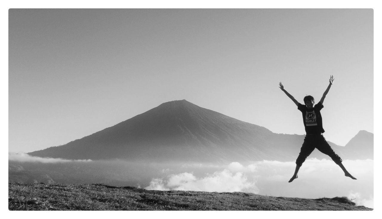 Full length of woman jumping in mid-air