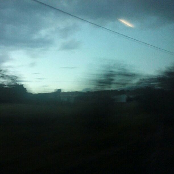 LOW ANGLE VIEW OF CLOUDY SKY OVER SILHOUETTE TREES