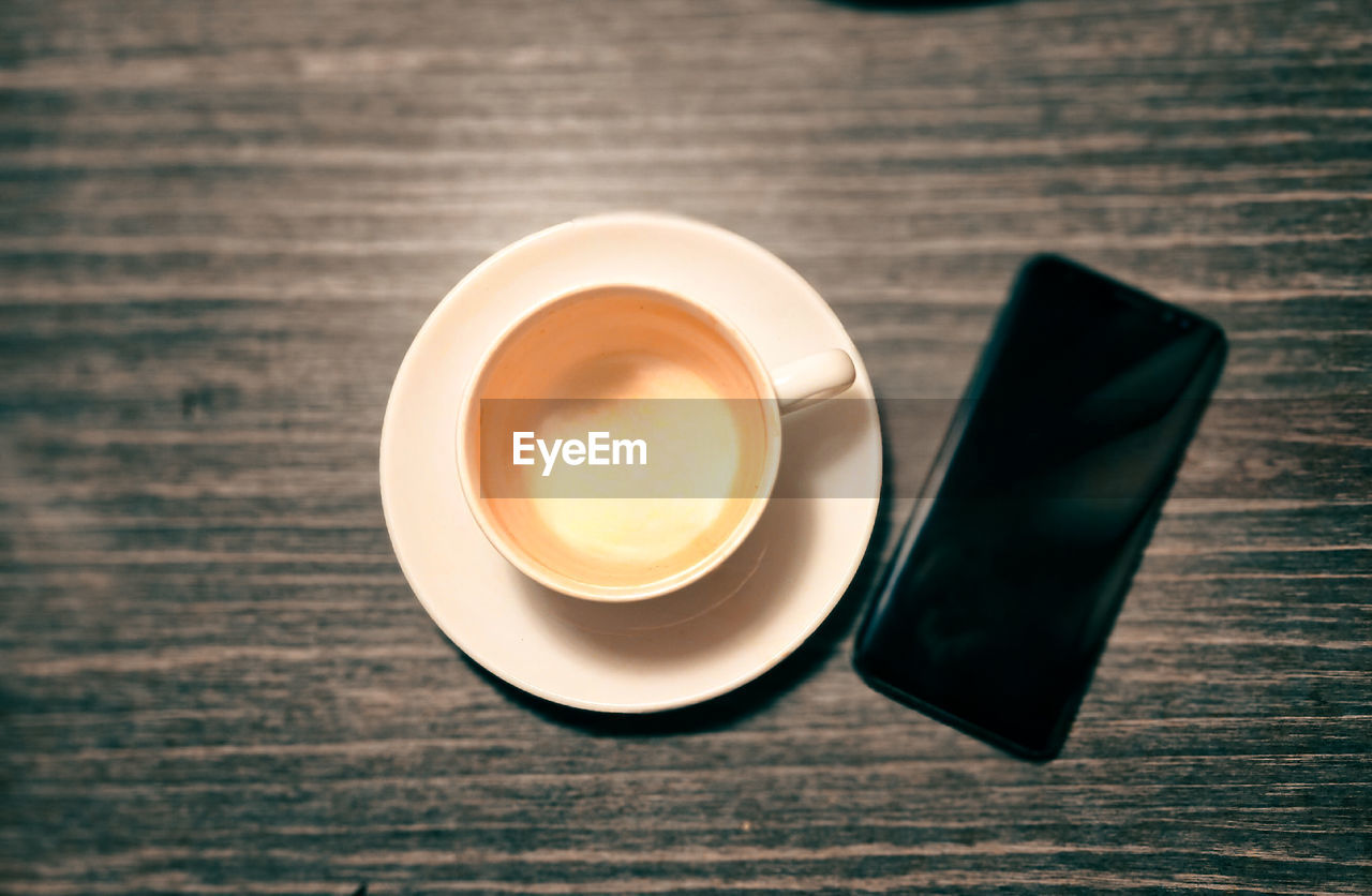 high angle view of coffee on wooden table