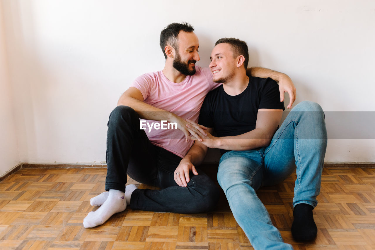 Gay couple in their apartment.