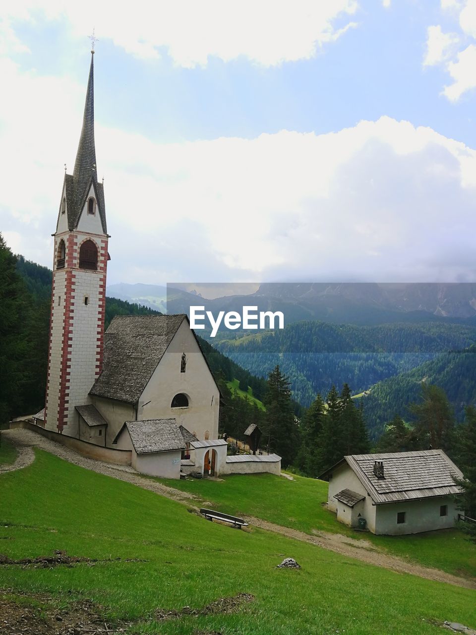 TEMPLE BY BUILDING AGAINST SKY