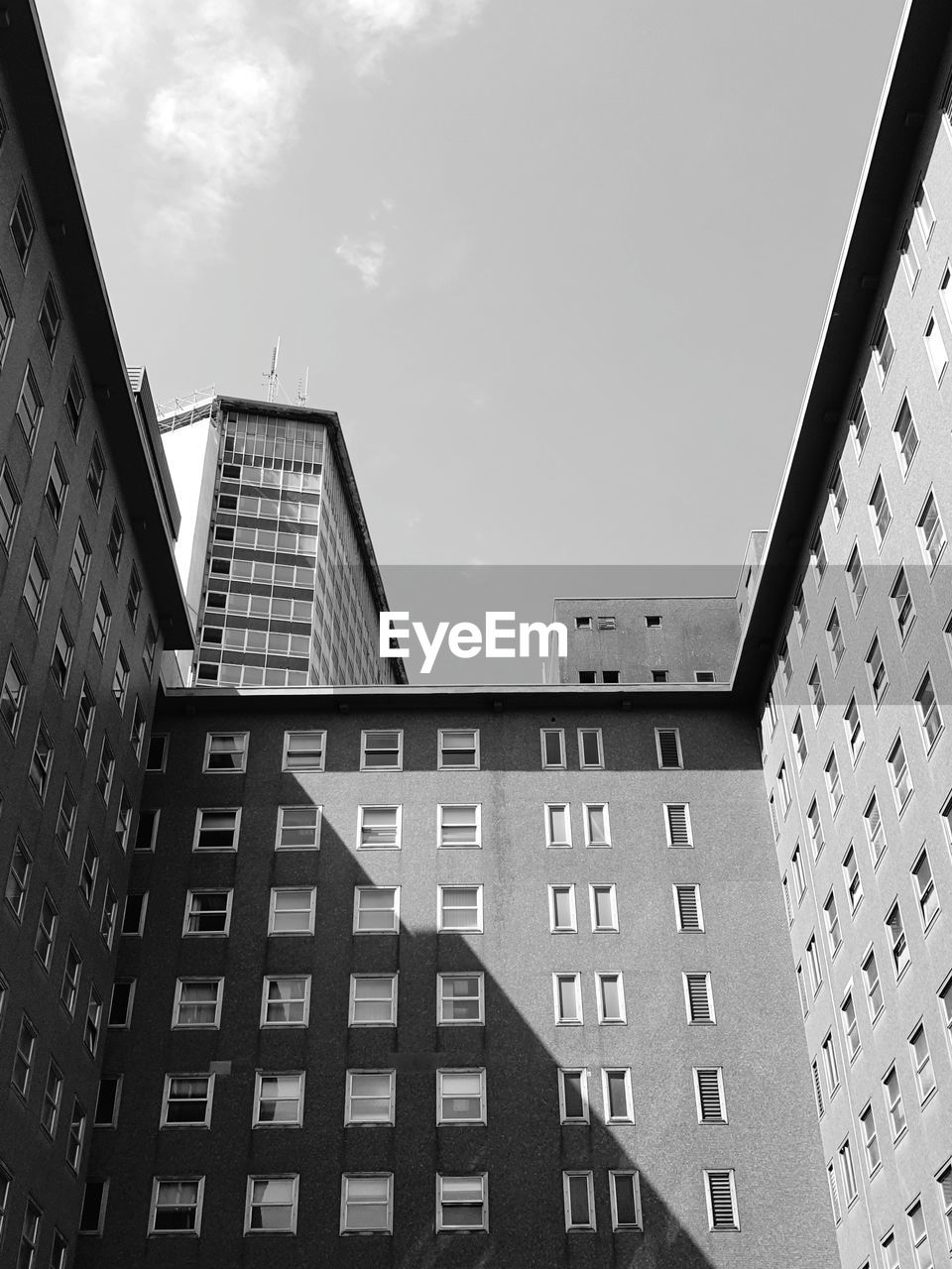 Low angle view of buildings against sky in city