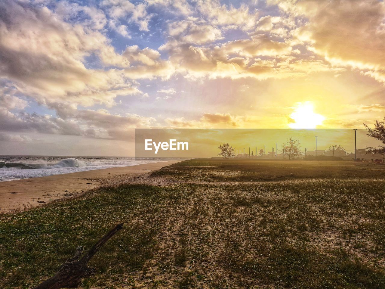 SCENIC VIEW OF SUNSET OVER SEA